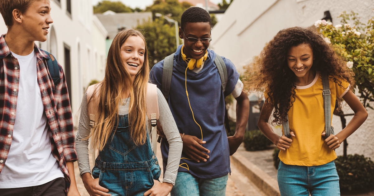 Friends walking together in an alley